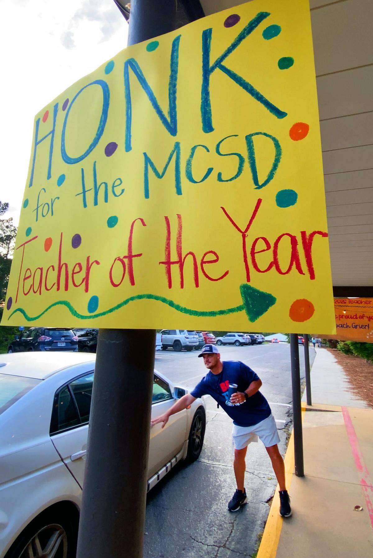 Clubview Elementary School physical education teacher Chris Grier greets students arriving for school May 8, 2026, the day after the Muscogee Educational Excellence Foundation named him the 2026 Teacher of the Year in the Muscogee County School District.