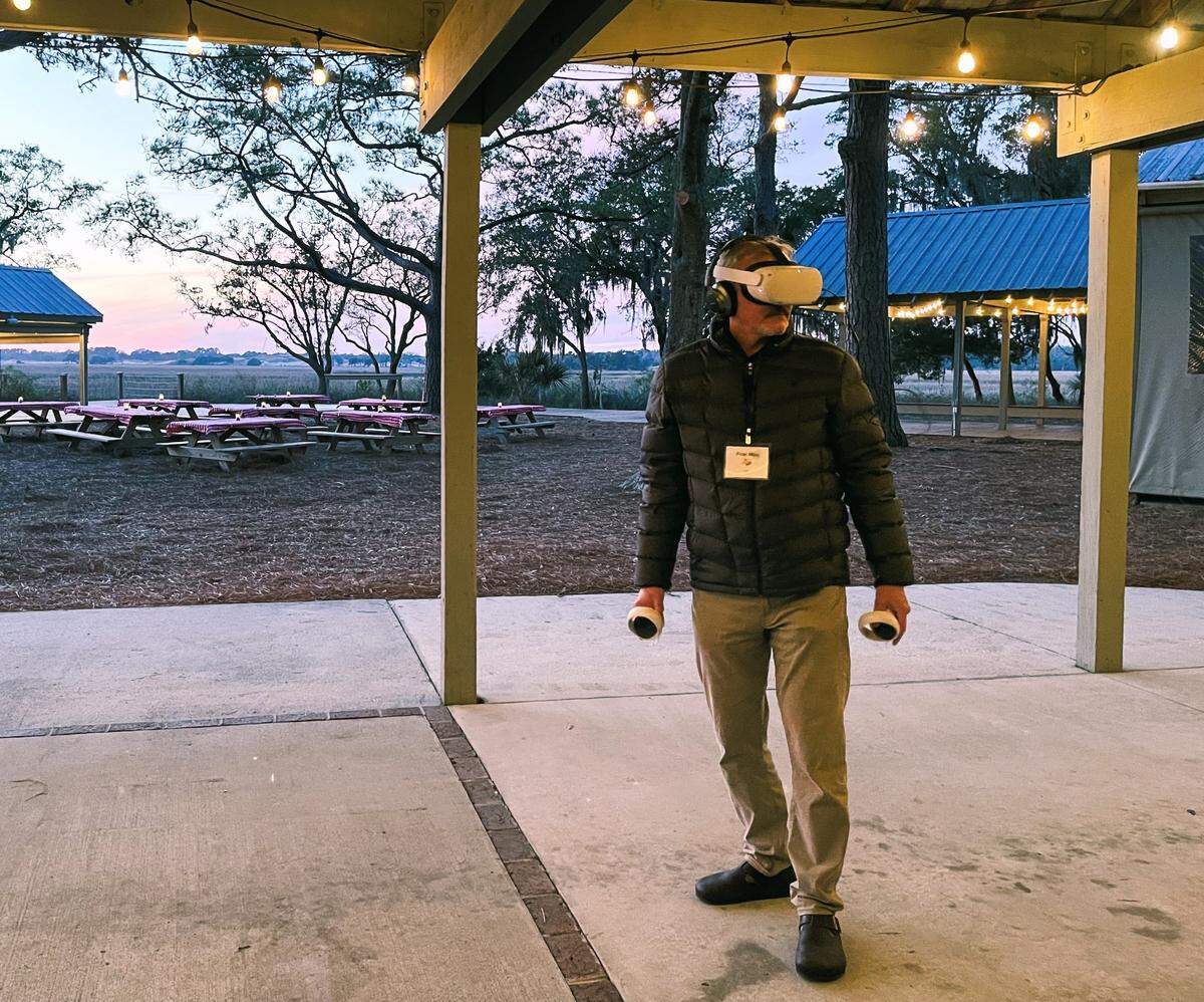 A coastal resilience community leader in Georgia tries out the vr headset Weather the Storm experience. The CACHE team used this to collect quantitative data and feedback.