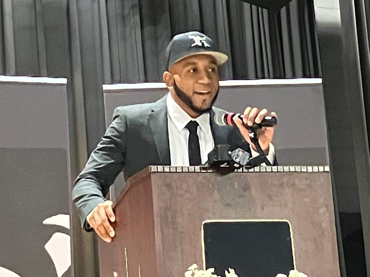 Johnny Garner speaks to the audience in the Shaw High School auditorium Feb. 2, 2023, after being introduced as the football program’s new head coach.