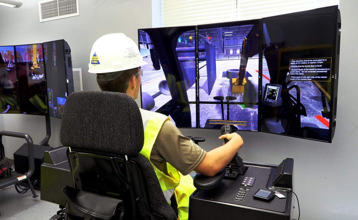 Kevin Hunt, 17, a junior at Jordan Vocational High School, works on a CAT Simulator as part of the school’s Heavy Equipment Operator Training Program. 09/23/2022