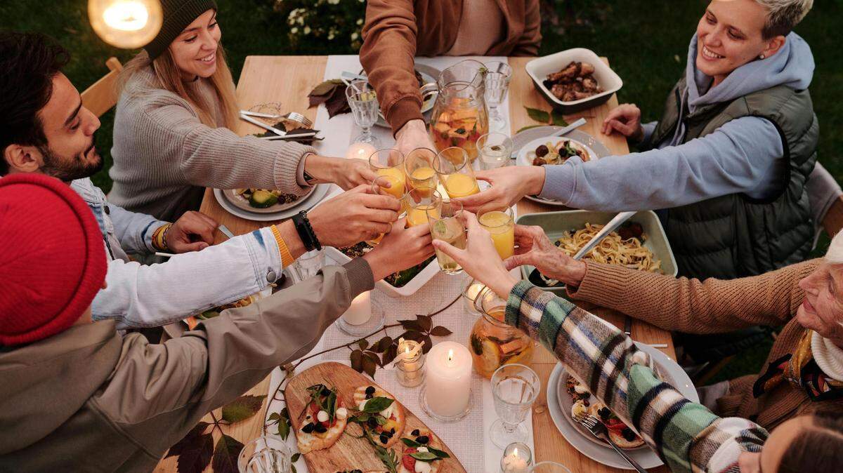 https://www.pexels.com/photo/family-doing-a-thanksgiving-toasts-5638751/
