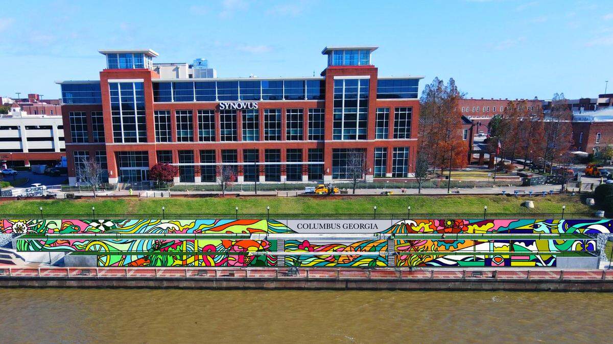 This is an artist’s rendering of what the new mural being painted along the Chattahoochee Riverwalk will look like when completed. It stretches along the riverbank’s three-tiered retaining wall where the Synovus Centre, 1111 Bay Ave., overlooks the Riverwalk between two of the most popular attractions on the riverfront: Waveshaper Island and Woodruff Park. 06/15/2023