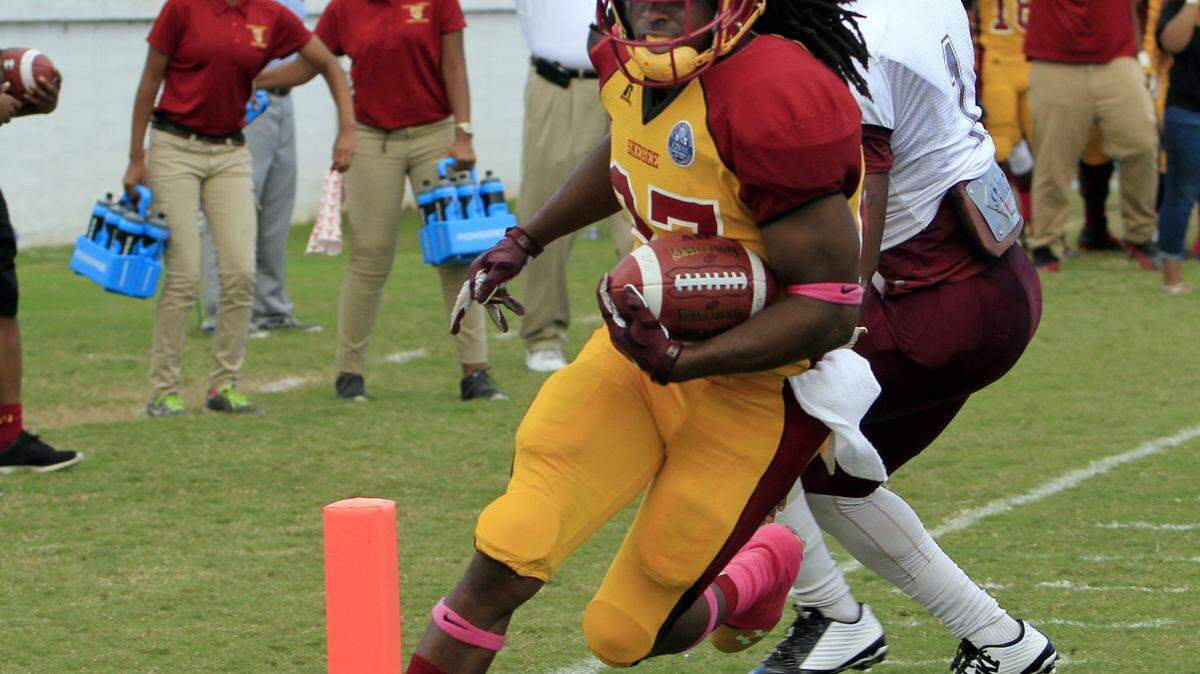 ROBIN TRIMARCHI rtrimarchi@ledger-enquirer.com 
 Tuskegee University running back Tyre Brooks carries the ball in for a touchdown in the first half against Morehouse College at Memorial Stadium Saturday. 10.10.15
