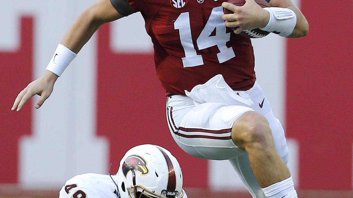 Associated PressAlabama quarterback Jake Coker runs past Louisiana-Monroe defensive lineman Ben Banogu during the first half last Saturday.