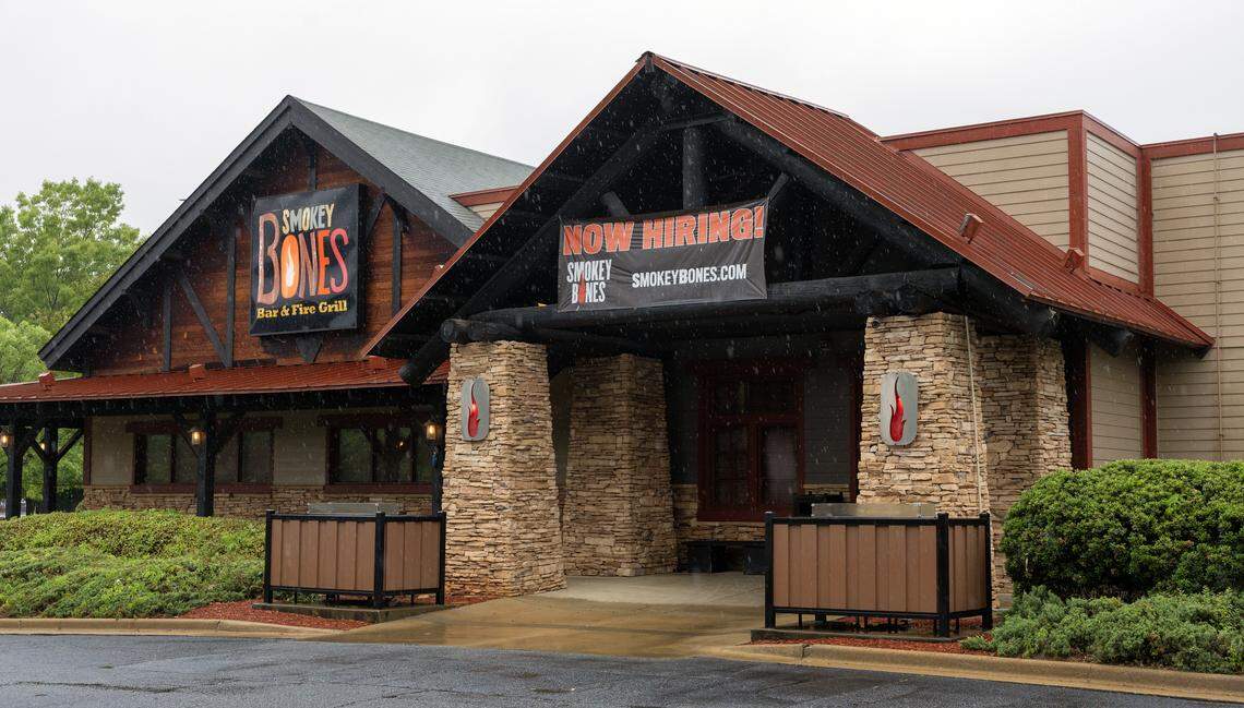 A sign on the door of the Smokey Bones in Columbus, Georgia said the restaurant has permanently closed as of April 28, 2026. 04/28/2026