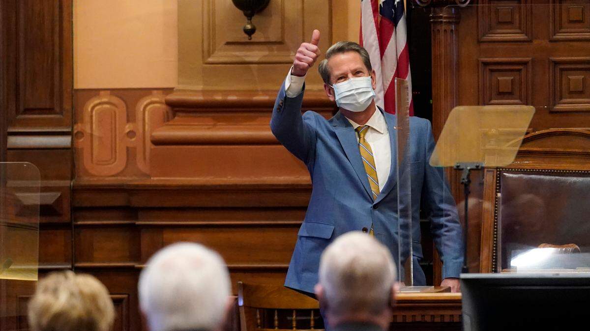 Georgia Gov. Brian Kemp gestures to lawmakers after delivering his State of the State address in the House Chambers Thursday, Jan. 14, 2021, in Atlanta. (AP Photo/John Bazemore)