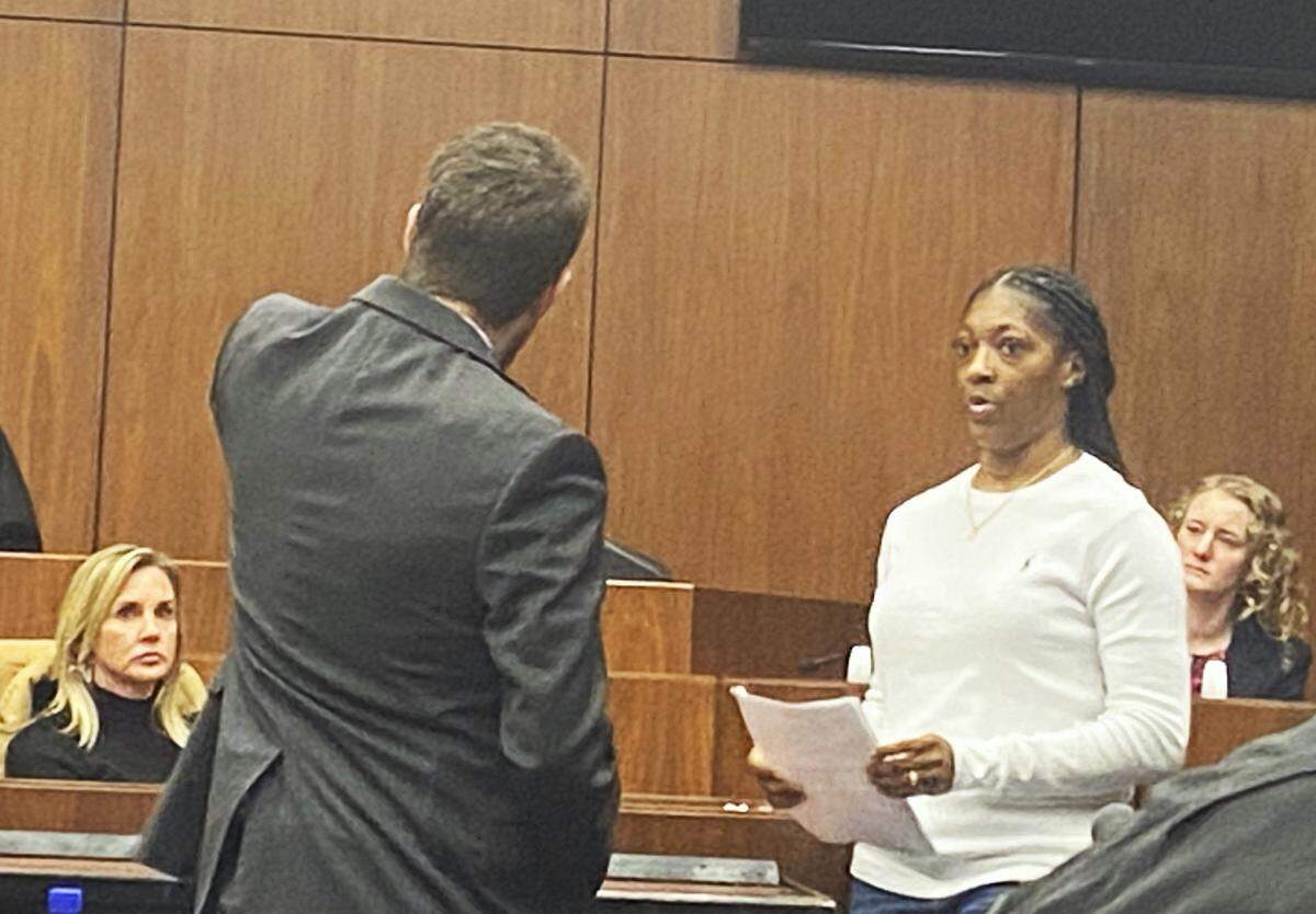 Shanequa Williams prepares to testify in the sentencing of Michael Simmons, who was convicted of murder in the fatal beating of her uncle Christopher Williams.