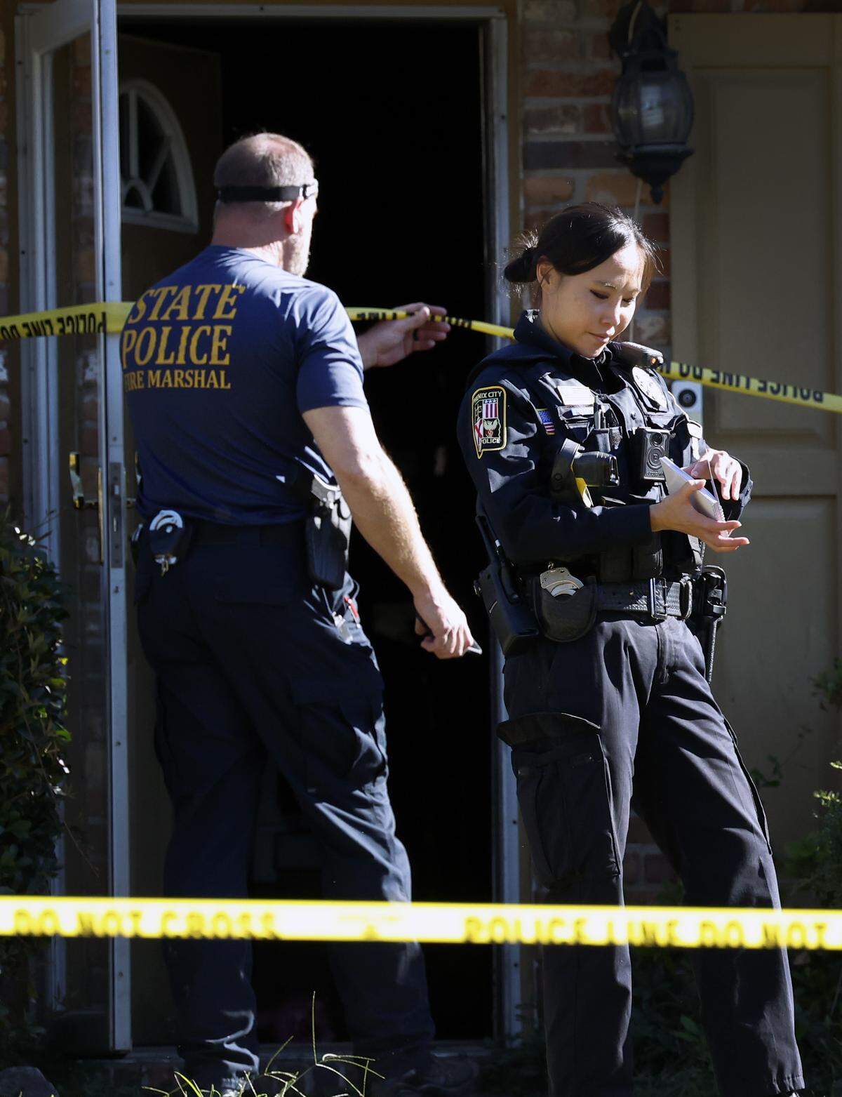Law enforcement officers are at 915 Wehring Lane in Phenix City the morning of Oct. 14, 2025, after four members of a family died in a house fire the previous night, according to Russell County Coroner Arthur Sumbry Jr. The cause of death is due to “possible smoke inhalation,” Sumbry said., and the cause of the fire is under investigation.