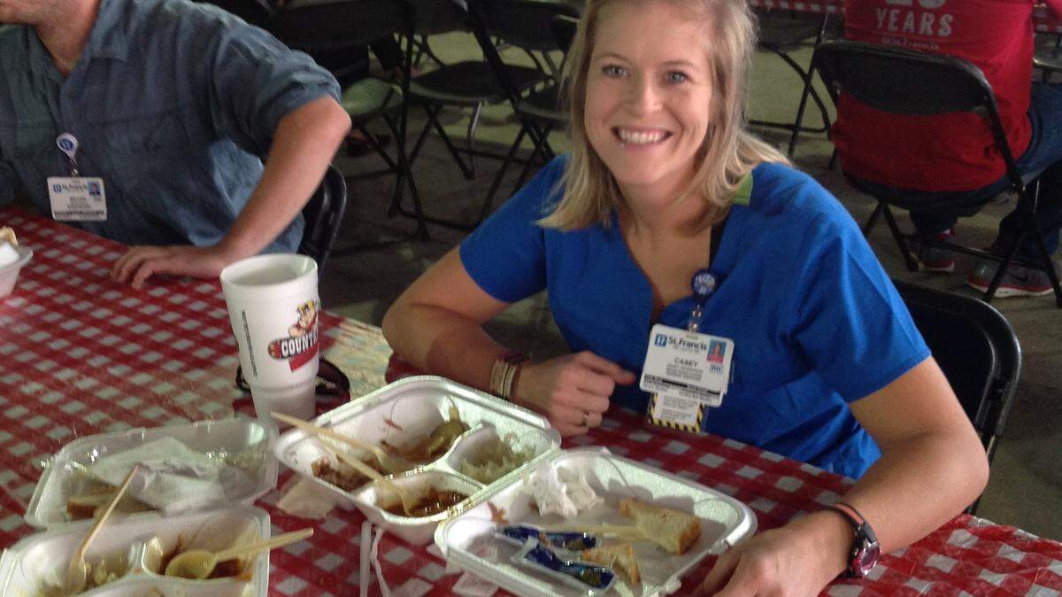 CHUCK WILLIAMS/chwilliams@ledger-enquirer.com
Casey Henderson, who has worked at St. Francis Hospital for five years, enjoys a Country's Barbecue meal Thursday during employee appreciation day.