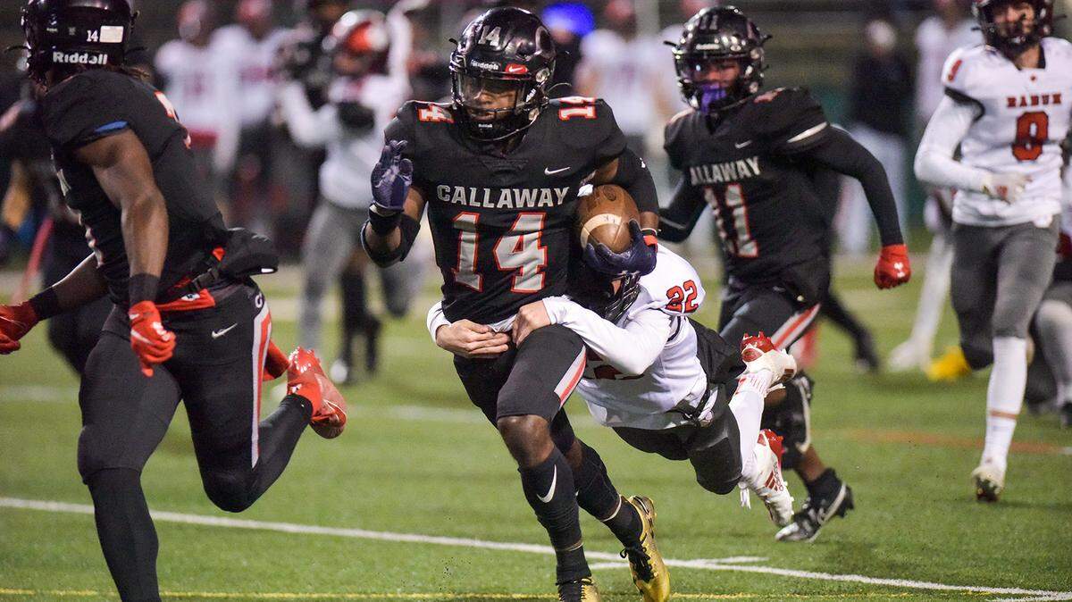 Callaway’s Carlos Billingslea carrying tacklers as he returns a kickoff in the 1st quarter of the game against Rabun during the semi-finals game Friday night, December 18, 2020