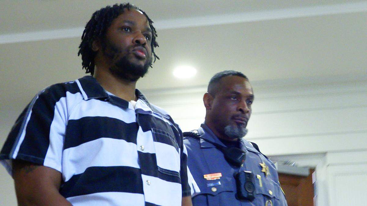 Jeremy Tremaine Williams, center, is escorted from the courtroom Wednesday afternoon after a hearing before Circuit Court Judge David Johnson at the Russell County Courthouse in Phenix City, Alabama.