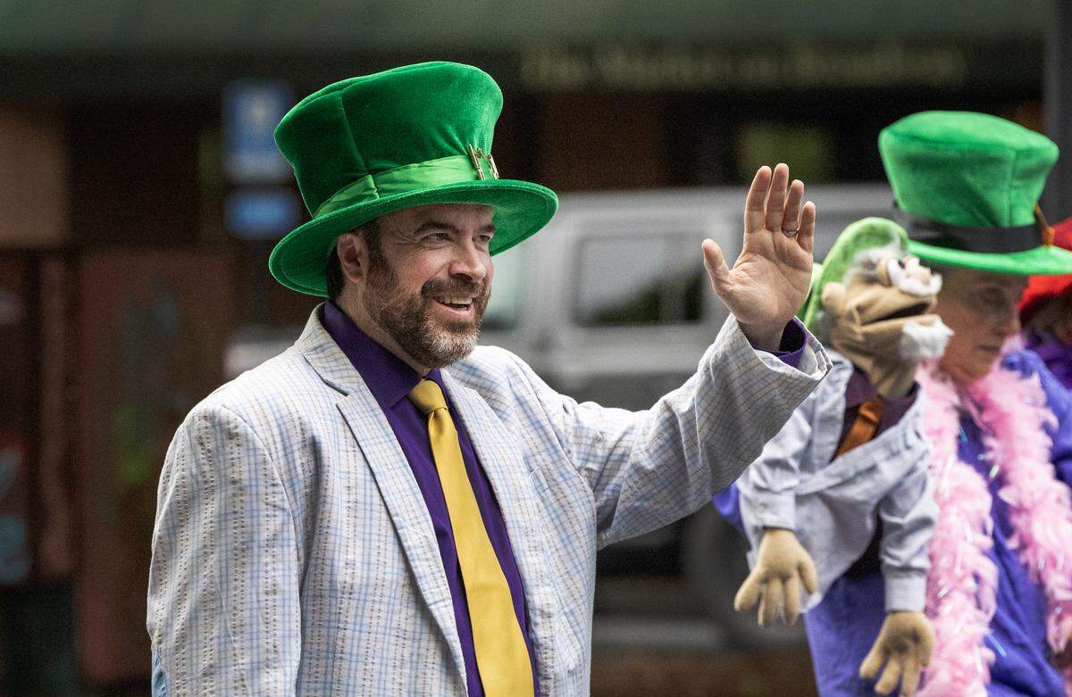 Stephen Scott, left, son of Strut the Hooch founder Steve Scott, traveled from his home in Tacoma, Washington, to participate in the May 2, 2026, parade in downtown Columbus, wearing the iconic costume his late father had worn as “Captain Hooch.”