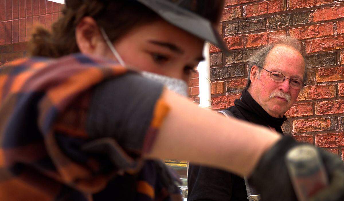 Harris County High School student Grace Senette practices her masonry skills recently under the supervision of Jim Steel, the school’s construction teacher.