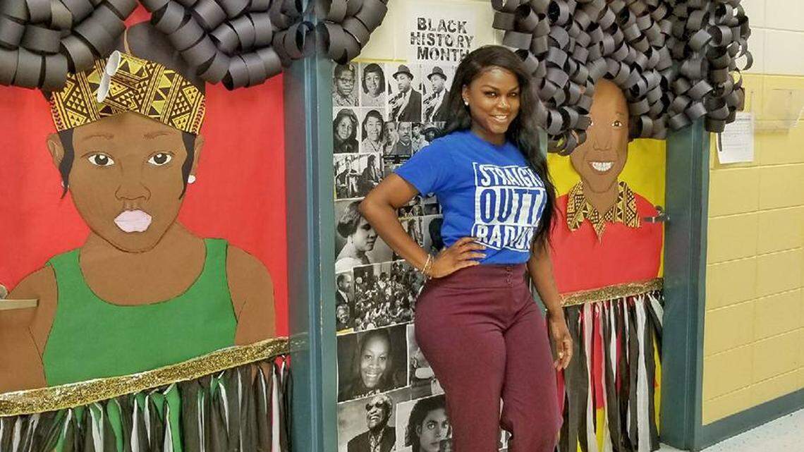 Nakimer Daniels stands by her decorated doors.