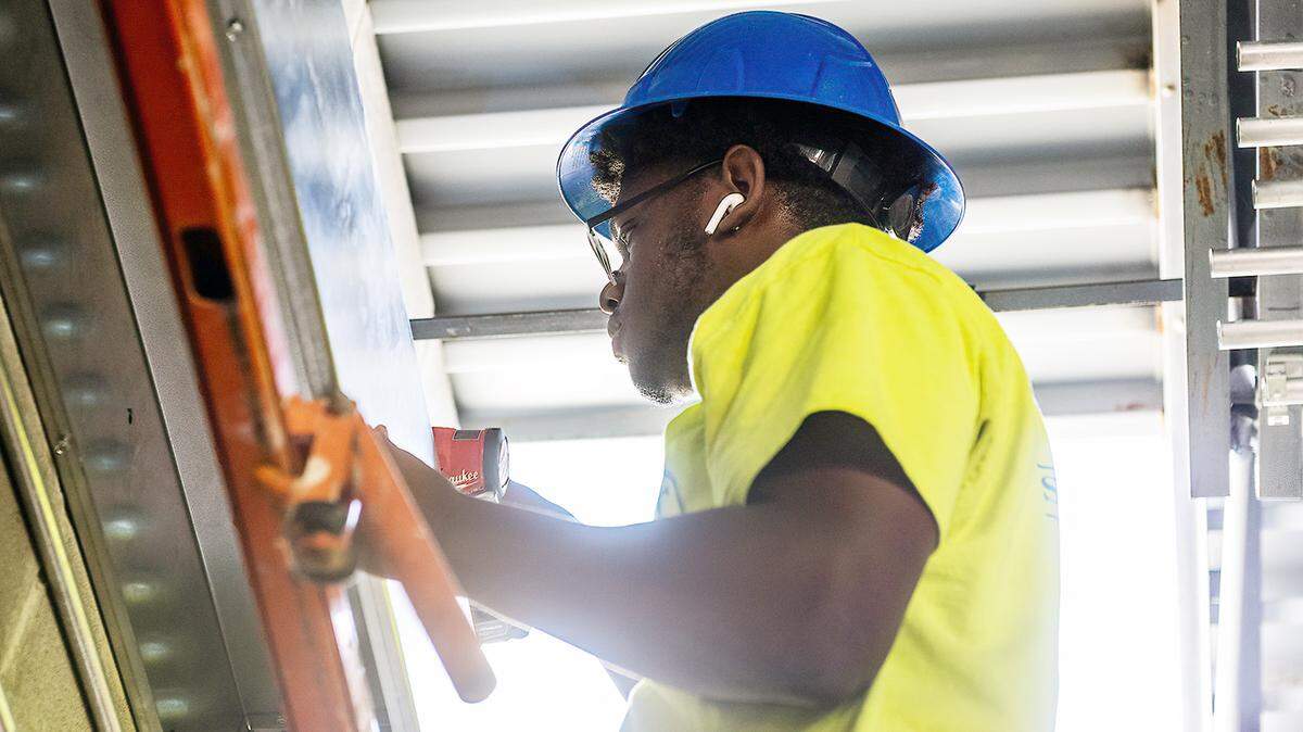 Central High School student Dearius Scott works as a construction intern on the job site of the Career Tech annex at the school. 5/20/2021