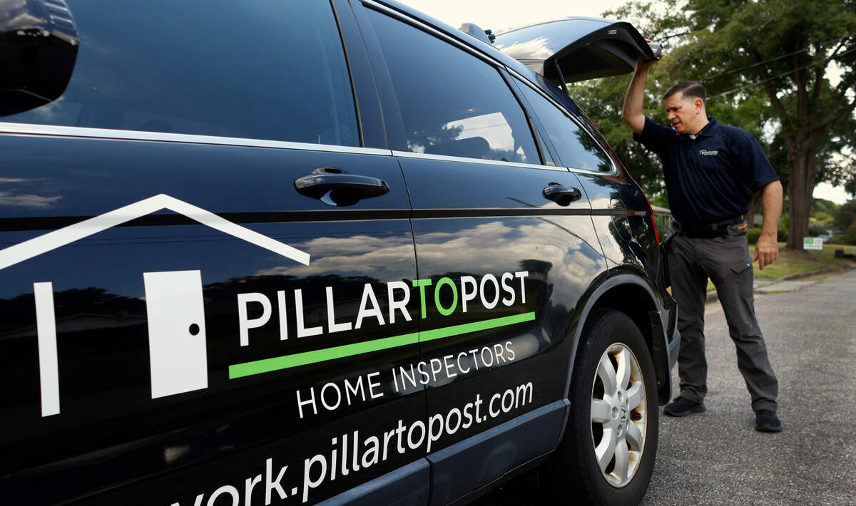 Ben York, a home inspector with Pillar to Post Home Inspectors, prepares to inspect a home in Columbus’ Oakland Park neighborhood.