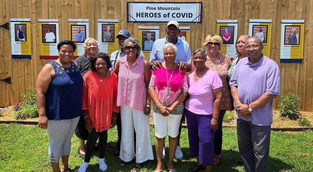 Pine Mountain’s Bethany Baptist Church members stand in front of the Chipley Historical Center’s new garden exhibit honoring Pine Mountain, Georgia heroes who combated food insecurity during the coronavirus pandemic.