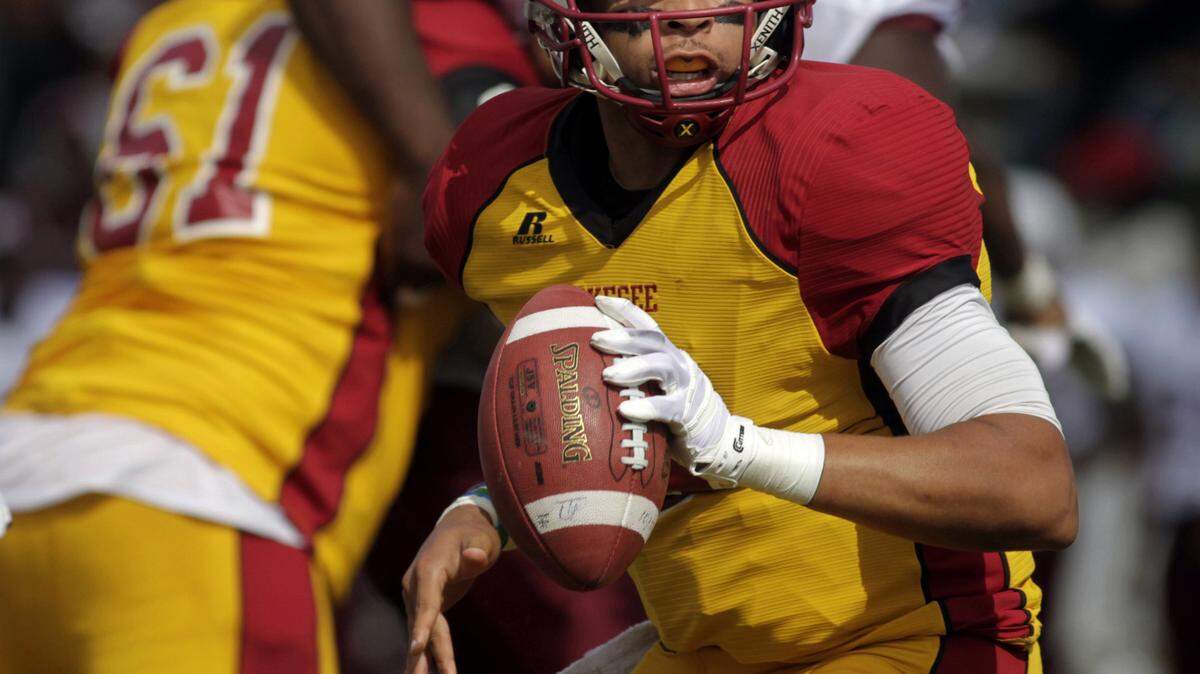 ROBIN TRIMARCHI rtrimarchi@ledger-enquirer.com 
 Tuskegee University quarterback Nicholas Pope looks for a receiver against Morehouse College in the first half against Morehouse College at Memorial Stadium Saturday. 10.10.15