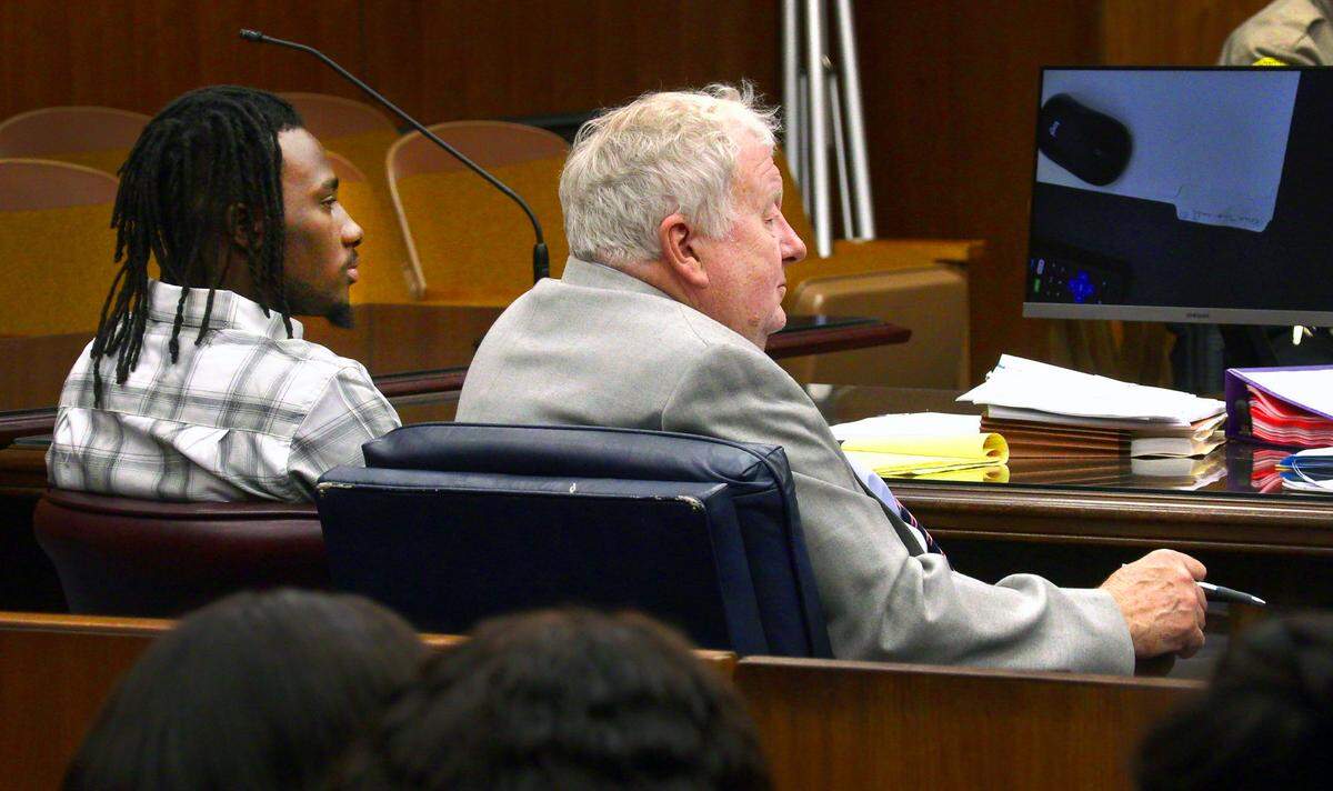 Lydell Maynard “Trapa” Sparks, left, and his defense attorney Mike Garner, listen to testimony Thursday morning. 06/16/2022