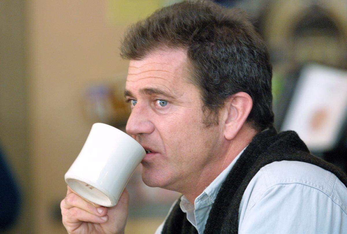 Mel Gibson sips coffee after lunch at the Four Winds Restaurant in Cusseta, Ga., in 2000, after meeting with U.S. Army Rangers at Fort Benning. Gibson chose Fort Benning to shoot scenes for the movie “We Were Soldiers Once,” based on the book “We Were Soldiers Once ... And Young,” by Lt. General Hal Moore, who lived in Auburn, Al., and Joe Galloway, who was a war correspondent during Vietnam. Gibson portrayed General Moore in the the film. 01.04.2000