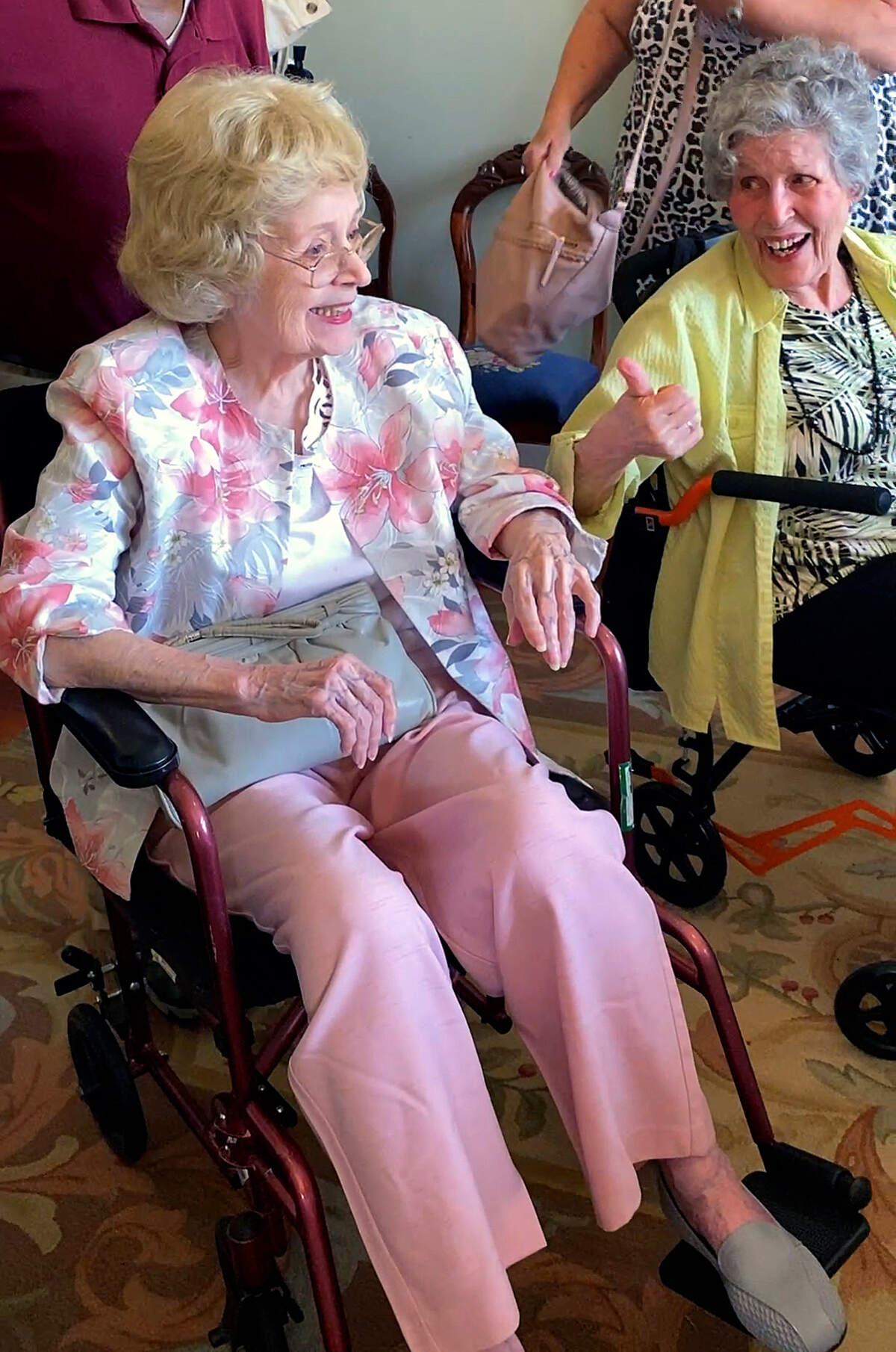 Friends and family June 9, 2026, at the Wynn House in Columbus to celebrate Lucile Lambert’s 100th birthday. Lambert, left, was born June 9, 1926, in Hayleville, Alabama. “You made it,” quipped Lambert’s younger sister, 85-year-old Mary Cunard, right, as Lambert entered the grand dining room to rapturous applause. Lambert worked for Central Georgia Railroad and Pound Construction in Columbus. She is the widow of former city manager Frank Lambert, who served in the role between 1971 and 1986.