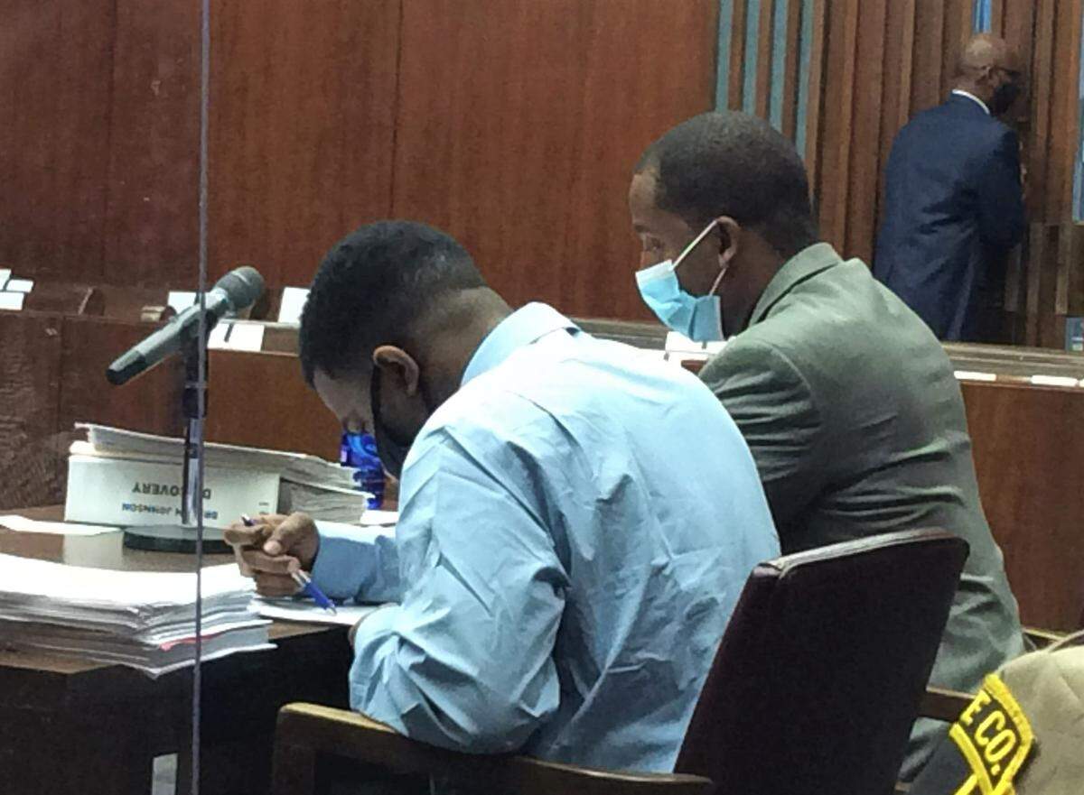 Drevon Johnson sits with defense attorney Anthony Johnson during his trial in Muscogee Superior Court.