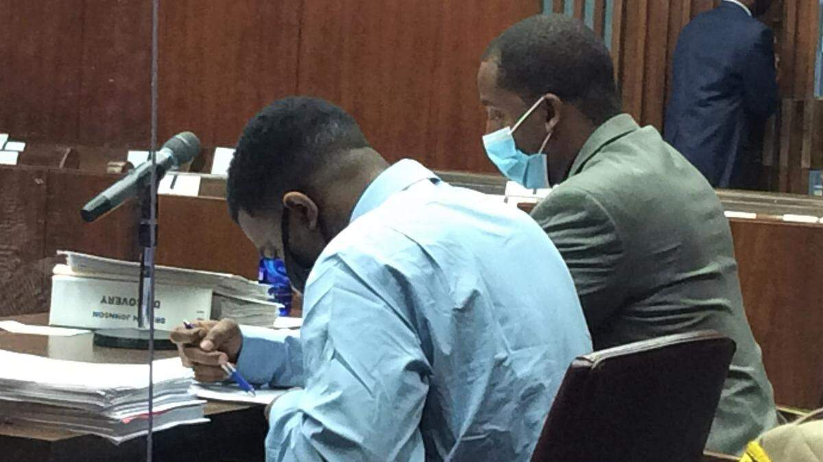 Drevon Johnson sits with defense attorney Anthony Johnson during his trial in Muscogee Superior Court.