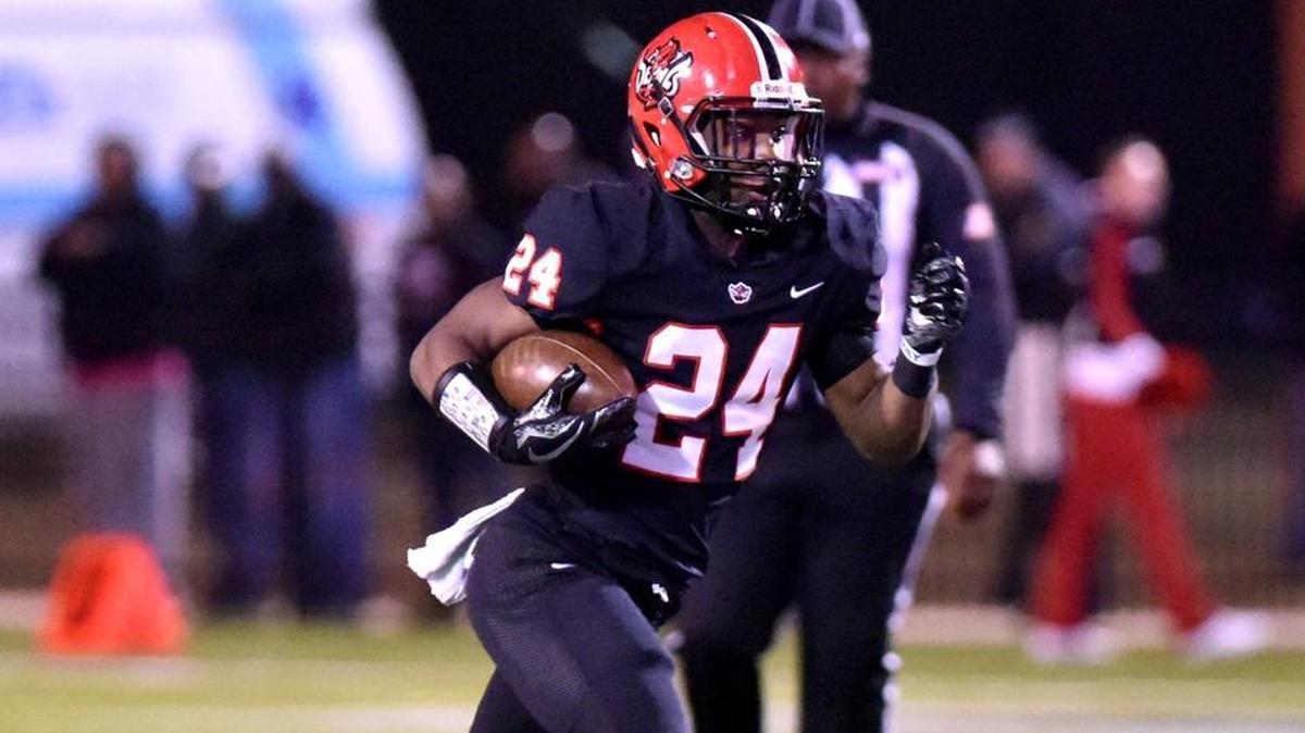 In this file photo, Central’s A’montae Spivey moves past the Montgomery-Lee defenders for a long run in the second quarter of the second-round state playoff game November 17, 2017.
