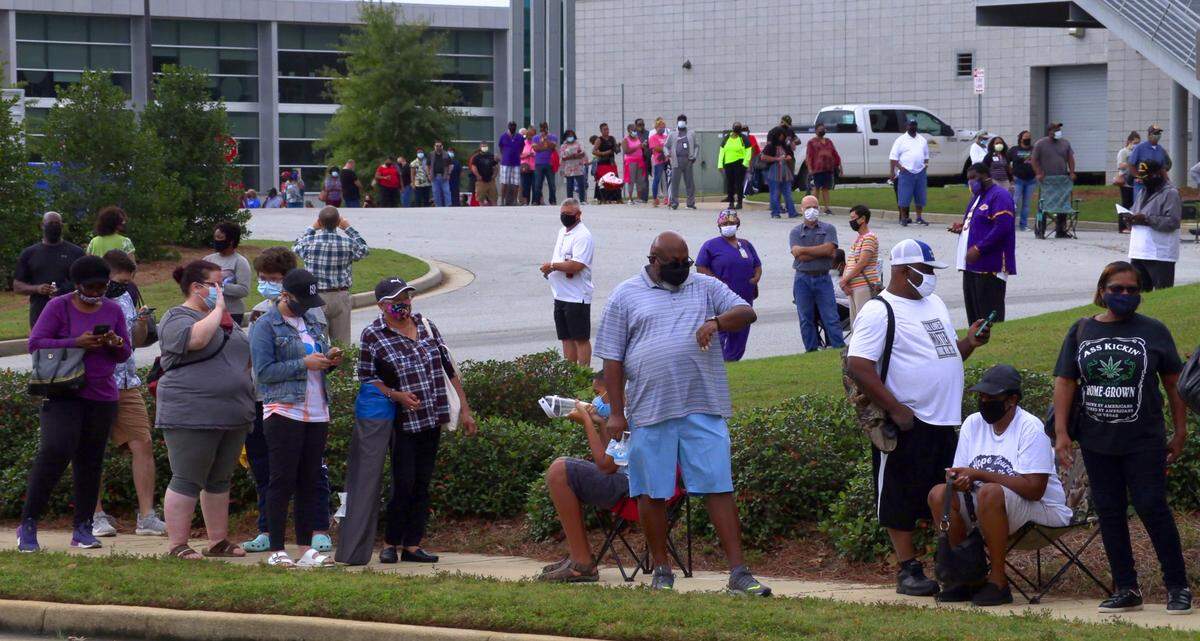 Columbus voters turned out in force Monday for the first day of in-person advance voting at the Citizens Service Center in Columbus, Georgia. At one point before noon more than 500 people were lined up outside the building in a line.