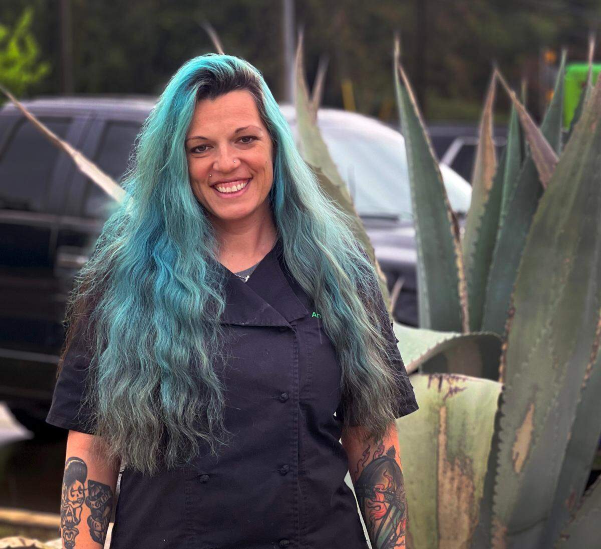 Angie White, owner of Tuesdays Street Tacos & Burritos and founder of the Women in Business Columbus GA Facebook group, stands outside her restaurant on Williams Road in March 2023.