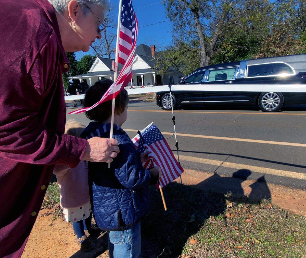 Spectators young and old lined the route to view t he funeral procession for Rosalynn Carter in Plains, Georgia on Wednesday afternoon. 11/29/2023