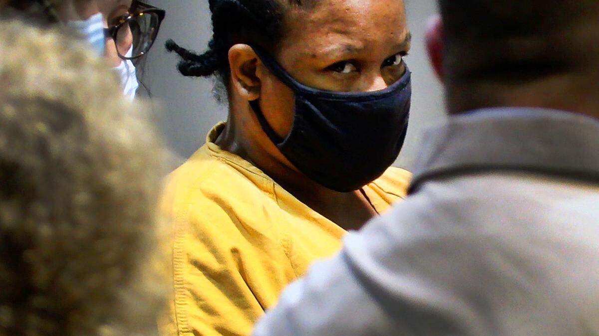 Shanita Evette Wyatt, 40, center, appears for a hearing in Columbus Recorder’s Court Friday morning. She has been charged with murder in the April 2008 death of Paul Hill, 67.
