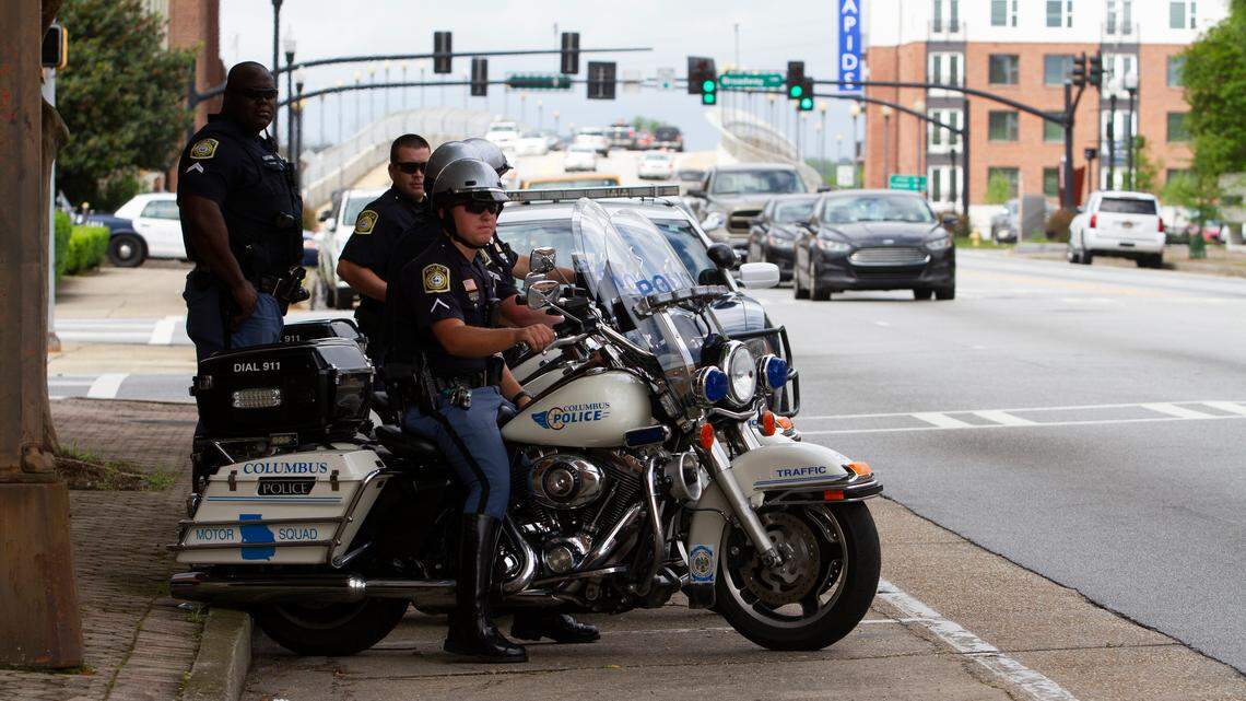 Officer Jonathan Hastings with Columbus Police Department Motor Squad looks out towards traffic during the department’s increased presence on 13th Street for Distracted Driving Enforcement Week on Tuesday, March 9, 2019, in Columbus, Ga.