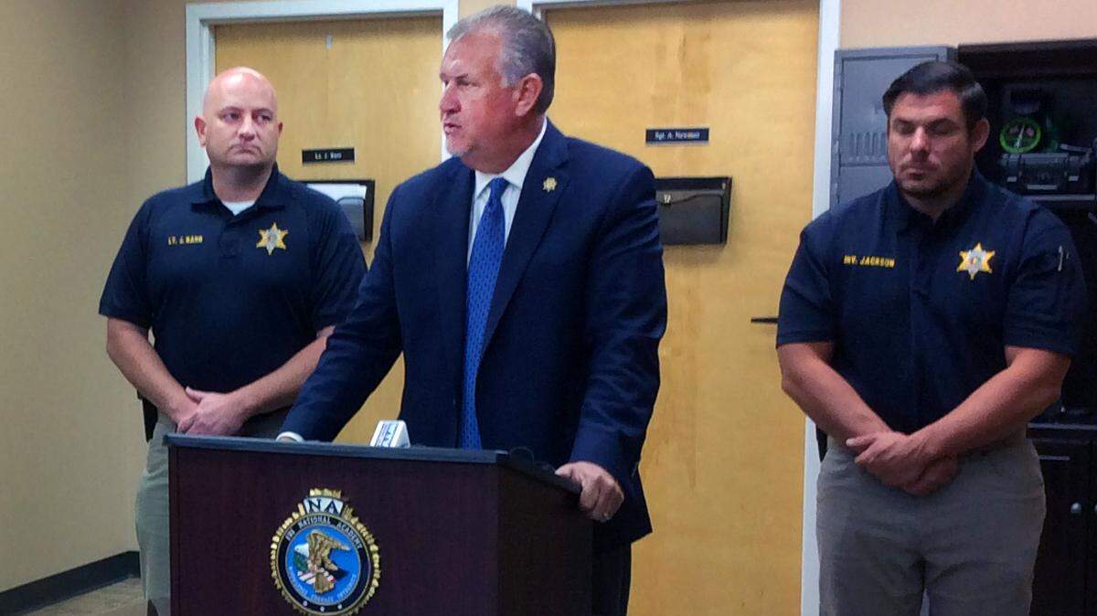 Russell County Sheriff Heath Taylor, center, speaks to the media during a Tuesday morning press conference at the Russell County Sheriff’s Office. Taylor is flanked by Lt. Jarrod Barr, left, and Investigator Jake Jackson.