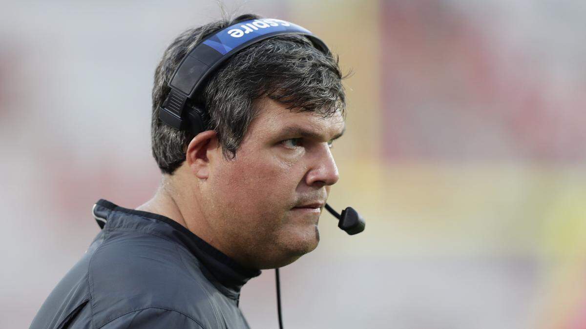 Mississippi head coach Matt Luke walks past his team during their game against Vanderbilt, in the second half of the NCAA college football game in Oxford, Miss., on Oct. 14, 2017. Mississippi won 57-35.