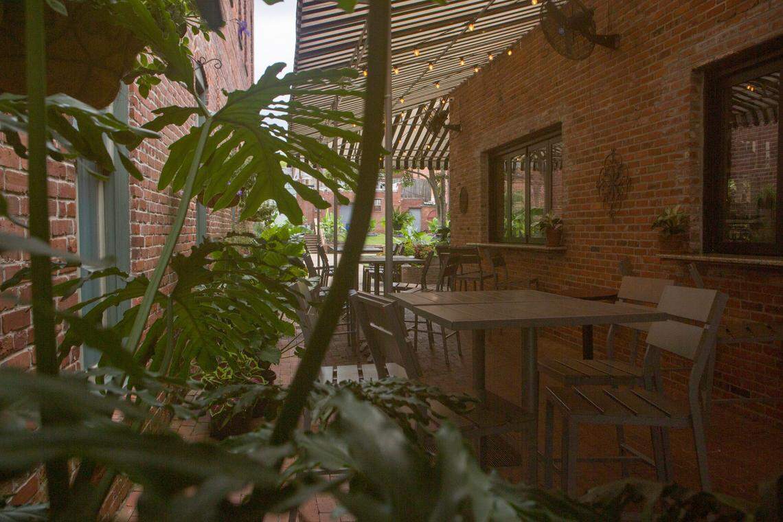 Tables are tucked into an alleyway near Saltcellar, 1039 First Avenue, in Columbus, Georgia, on June 28, 2021.