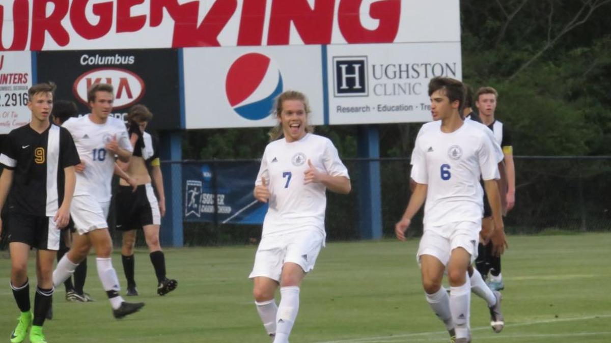 Columbus senior Tristan Shytle celebrates after his first-half header to give the Blue Devils an early lead. Shytle ended the game with a hat trick in the team’s 3-0 win over East Coweta on April 14, 2017.