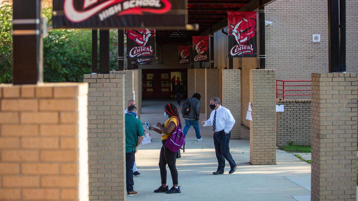 Teachers give students directions to their first class of the day at Central High School on Tuesday, August 18, 2020 in Phenix City, Ala.