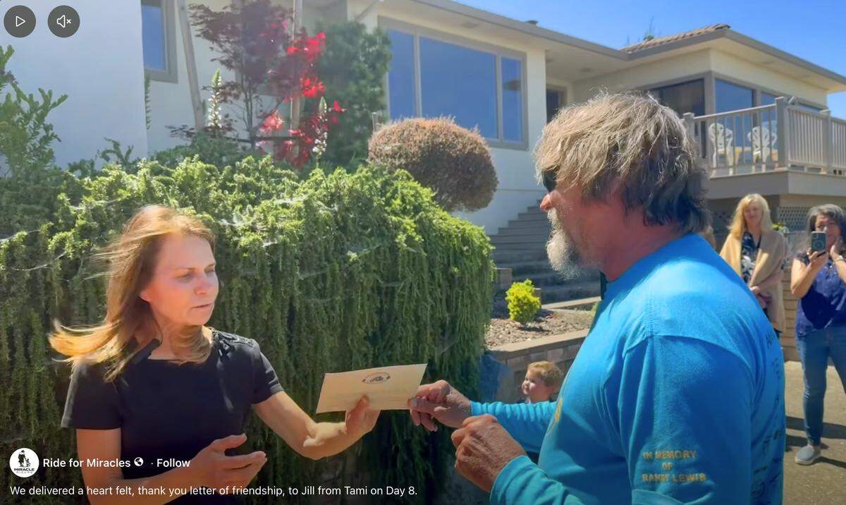 Scott Ressmeyer of Columbus delivers a postcard to Jill Eisner in Salinas, California, on May 8, 2026, during the Miracle Riders trip. The Miracle Ride is a 9,300-mile motorcycle ride from Columbus through 16 states to raise awareness and money for Columbus State University’s College of Education & Health Professions.
