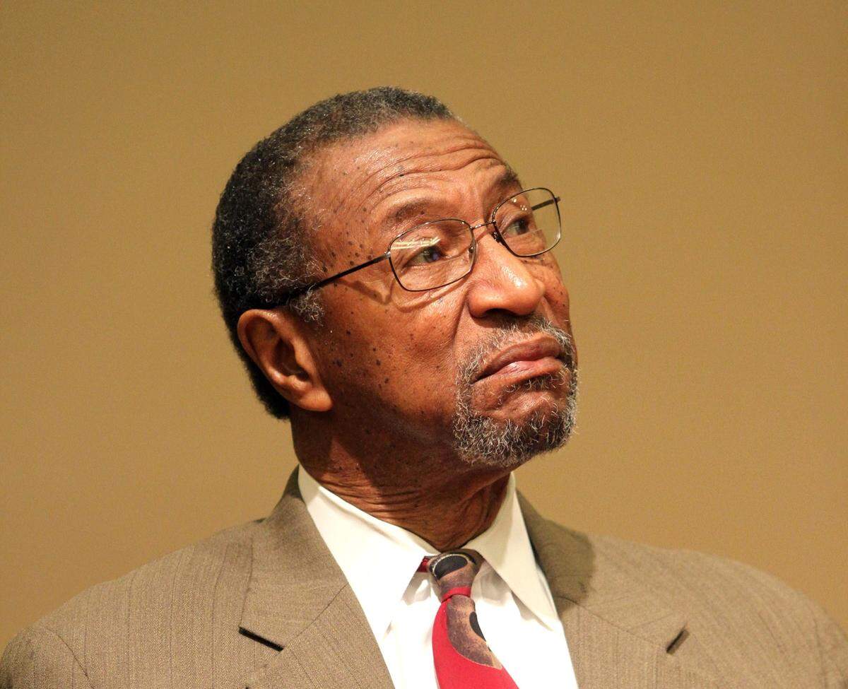 William “Bill” Wright listens to his daughter, Katonga, speak during a 2015 news conference.