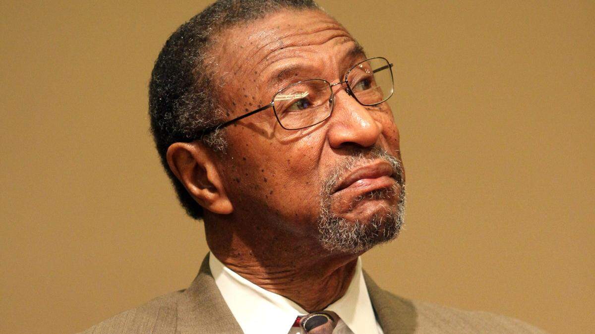 William “Bill” Wright listens to his daughter, Katonga, speak during a 2015 news conference.