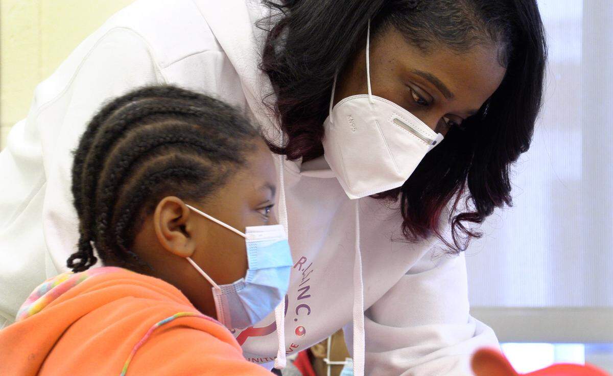 Shameika Averett, founder of Gigi’s PEARLS, Inc., works with a student at Dorothy Height Elementary School in Columbus, Georgia. 01/14/2022