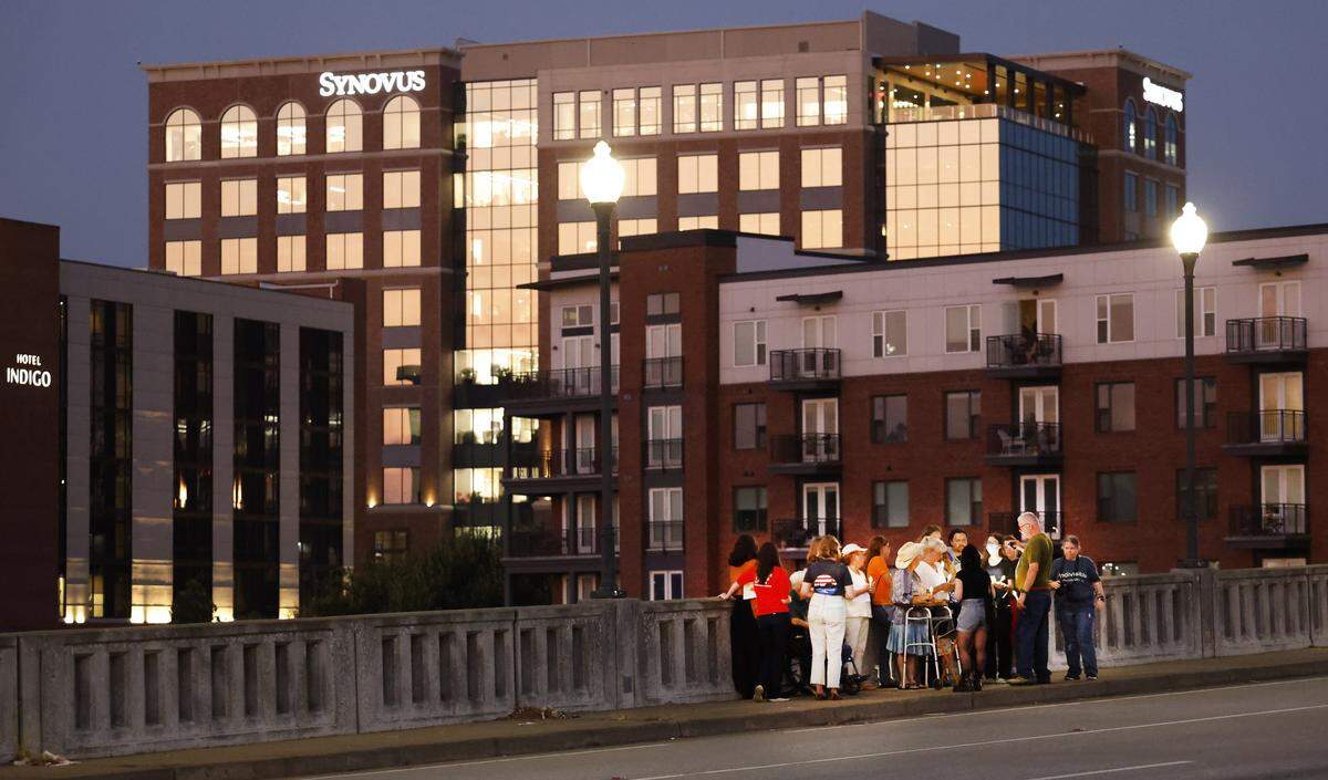 People gather Sept. 4, 2025, on the 13th Street Bridge, which connects Columbus, Georgia, to Phenix City, Alabama, for a candlelight vigil to remember and honor victims of gun violence. The event was organized by Phenix City Indivisible, Columbus, GA Indivisible and the Under the Muscadine Catholic Worker community.