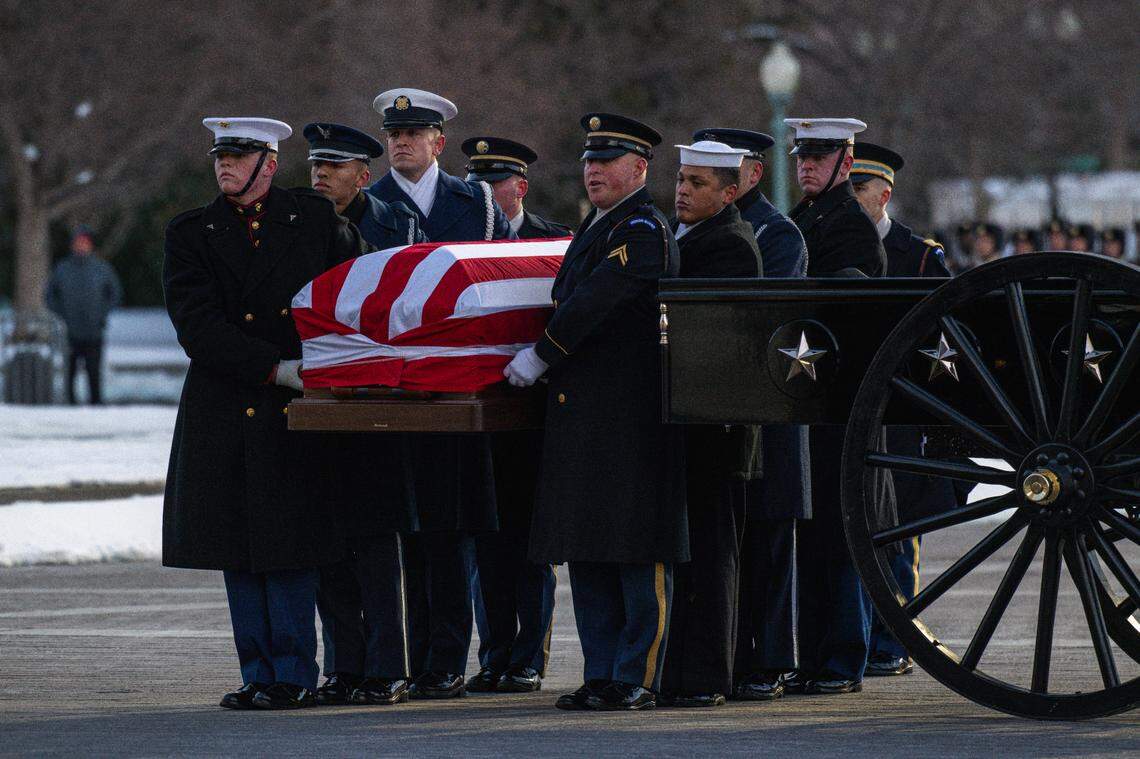 The Joint Service Body Bearer Team prepares to move the casket of former President Jimmy Carter into the U.S. Capitol building in Washington, D.C., Jan. 7, 2025. Carter, who was also a 2002 Nobel Peace Prize recipient for his humanitarian efforts, passed away on December 29, 2024, at his home in Plains, Georgia, at the age of 100.(DoD photo by Henry Villarama)