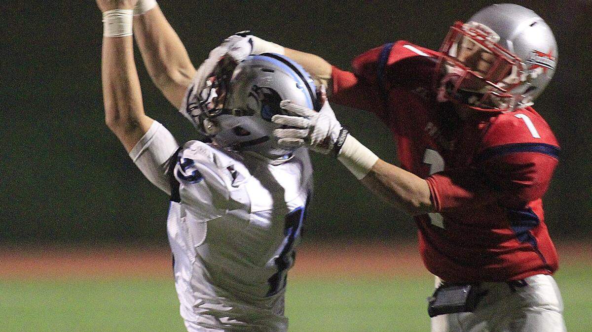 Mike Haskey mhaskey@ledger-enquirer.com 
 Northside's David Apaig,right, was unsuccessful breaking up this pass to Starr's Mill wide receiver Satchel Goodrich in the first half Friday night at Kinnett Stadium. 11/13/15