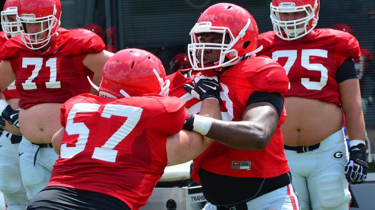STEVEN COLQUITT/Associated PressGeorgia offensive lineman Pat Allen (58), right, goes through a drill during the Bulldogs' session on the Woodruff Practice Fields Saturday in Athens, Ga.
