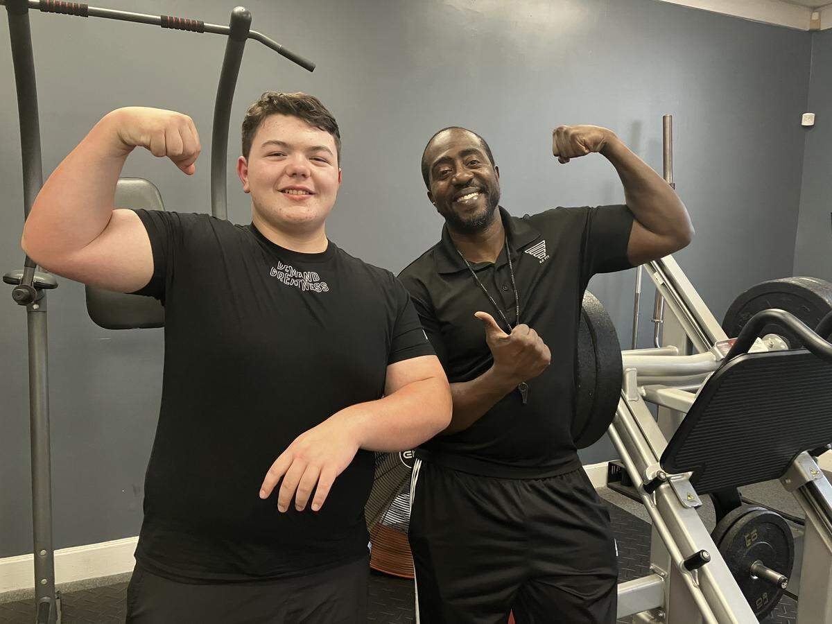 Nash Earwood, left, poses Nov. 7, 2025, with his strength coach, Terrence Flowers, at Flowers’ gym, 4.0 Fitness, 4701 Buena Vista Road in Columbus. Nash set three state records for 12-year-olds Sept. 13 at the USA Powerlifting event in Ringgold, Georgia.