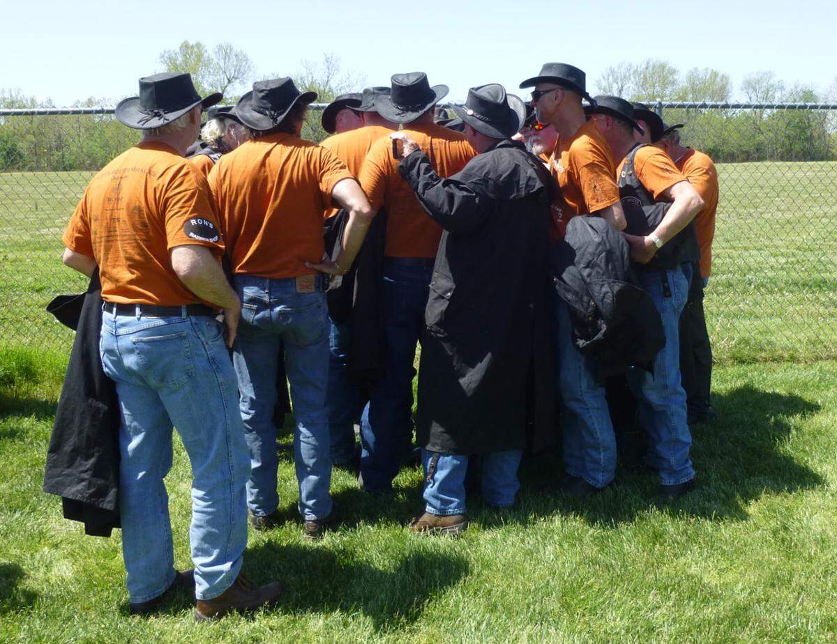 Miracle Riders gather next to a sign on the campus of Missouri Southern State University honoring Jonathan Hansen, a soccer player at Missouri Southern who died in February 2009 after collapsing on the court during an intramural basketball game on campus. Then 22, Jonathan was a senior goalkeeper on the men’s soccer team. His father, Brad Hansen, is a Miracle Rider.