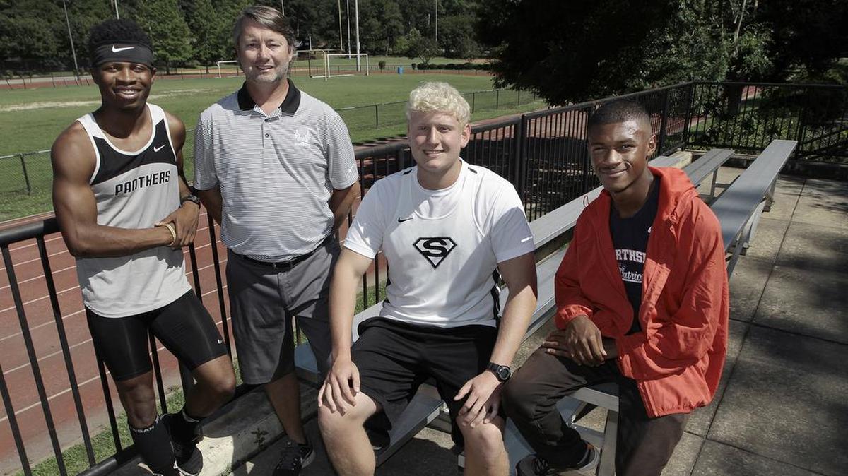 All-Bi-City Boys Track Coach of the Year Ron Peters of Smiths Station, second from left, and Athletes of the Year Charles Hughes of Smiths Station, left, Chad Stricklin of Smiths Station, center, and Jonathan Myrthil of Northside High, right