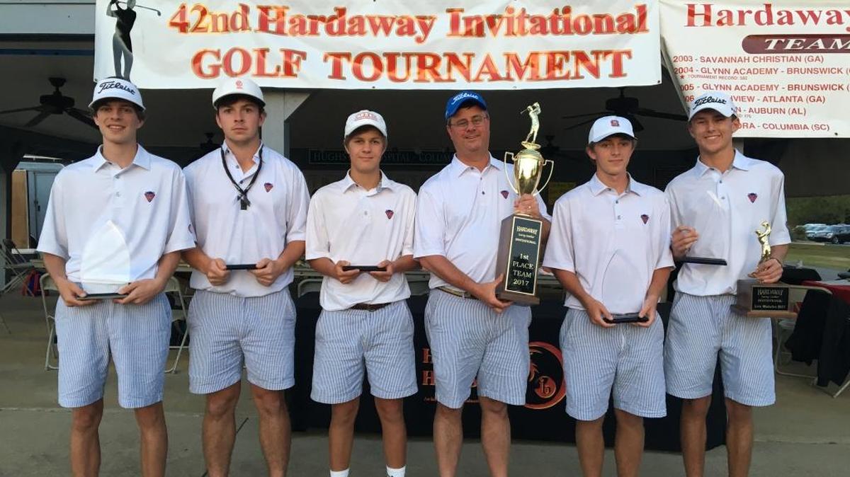 Columbus’ Daniel Davis, Ben Womack, Jonathan Parker, head coach Chris Parker, Ben Carr and Nolan Miller celebrate winning the 2017 Hardaway Invitational.